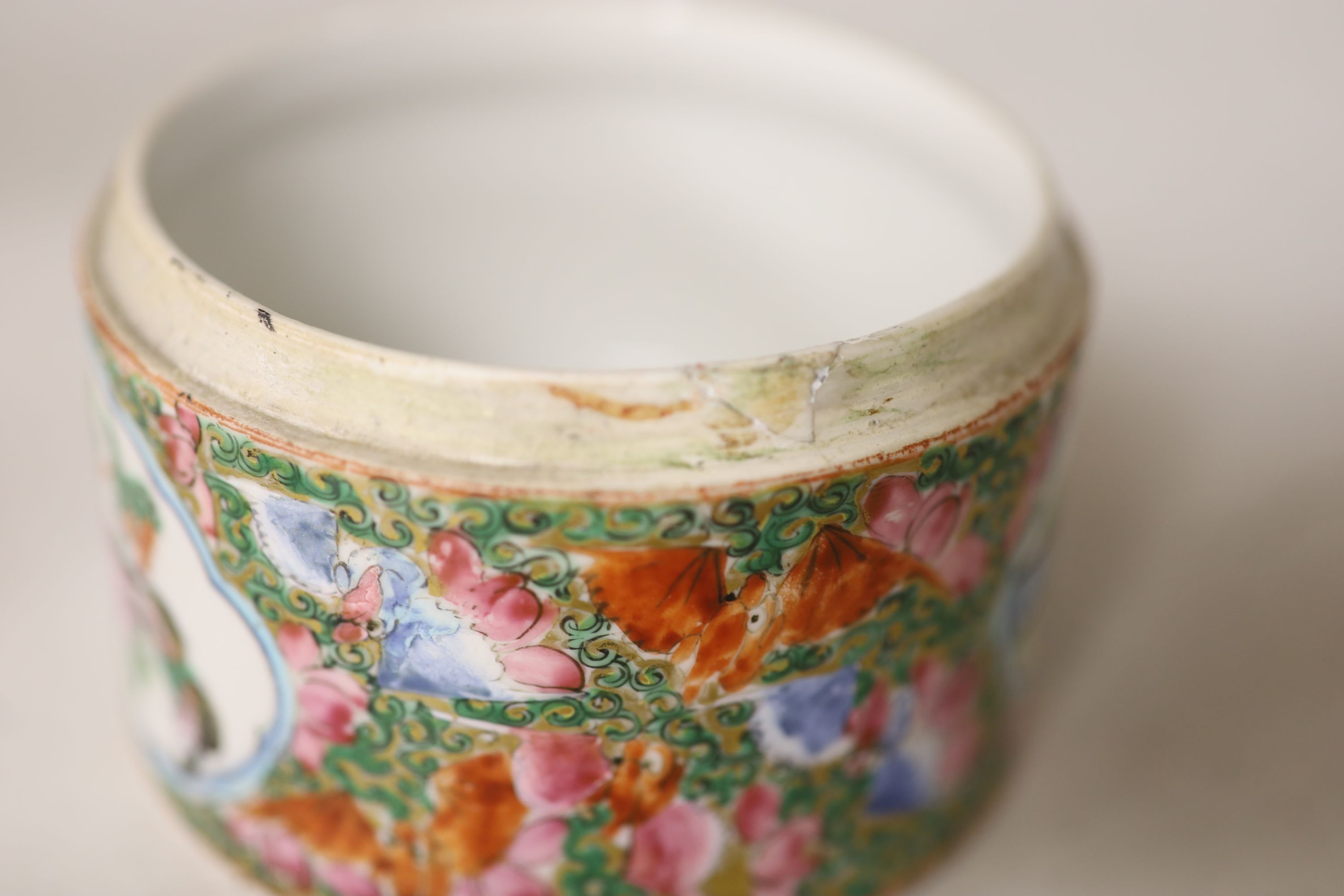 A Chinese famille rose box and cover, two vases, a sugar bowl and cover and a saucer, late 19th/early 20th century, tallest 19cm